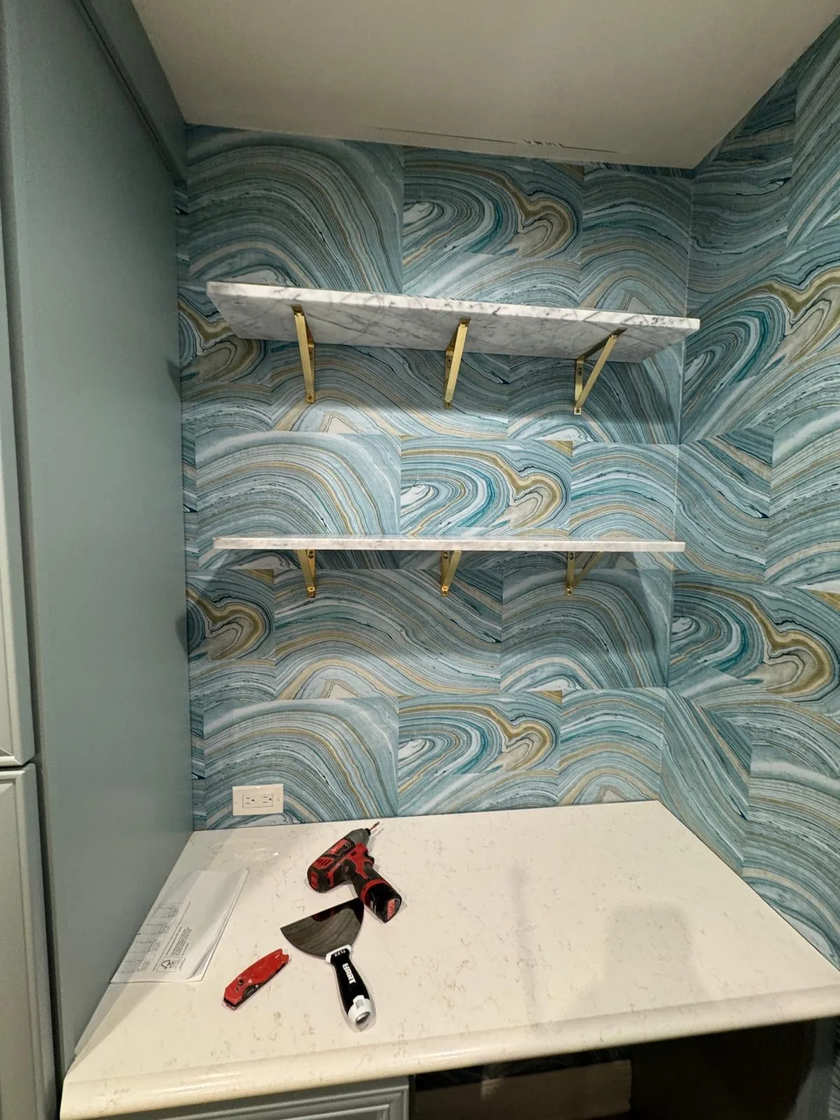 Interior wall finishing craftsmanship — wallpaper and paint detail in northwest Chicago suburbs